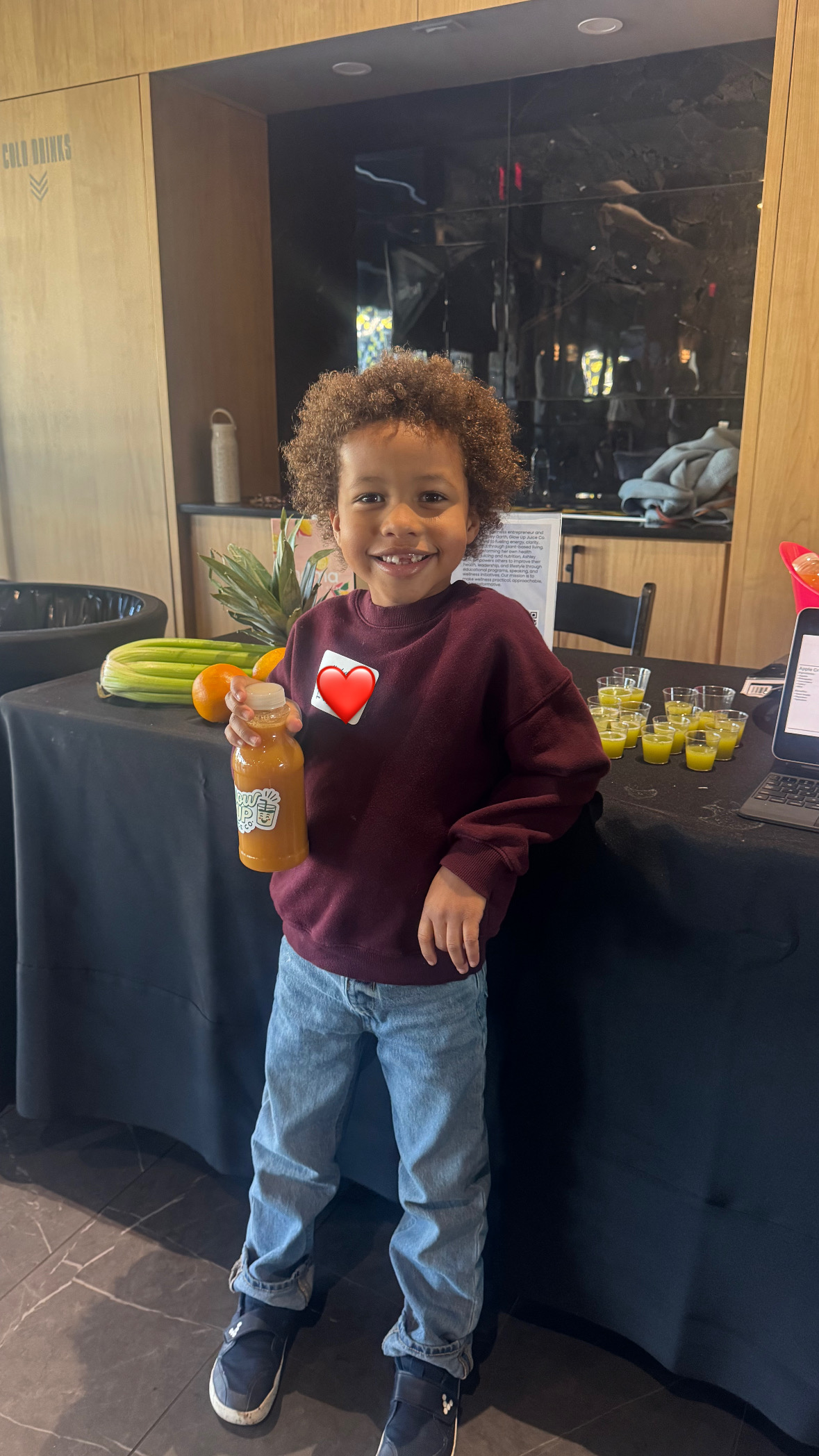 Kid enjoying Glow Up Juice